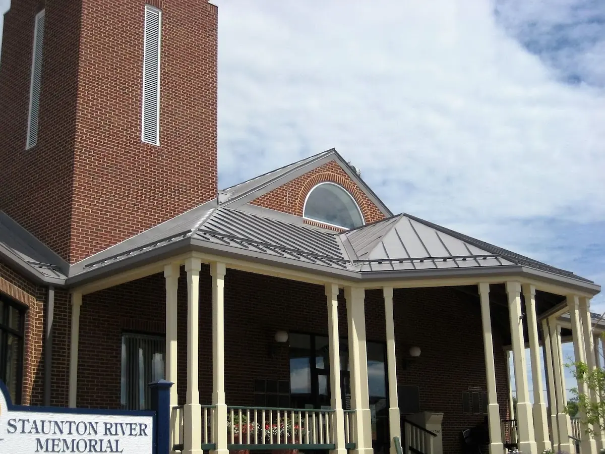 Skilled roofing craftsmen working on a residential roof in Downtown Bryan